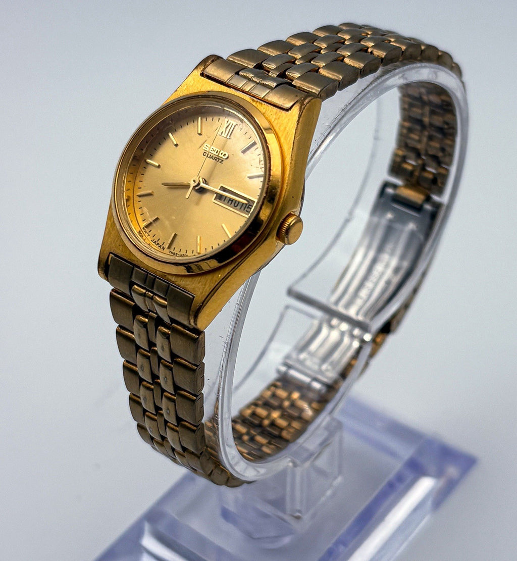 Vintage 1994 Seiko SQ Ladies Watch Gold Tone Day Date 25mm Roman 12 7N83-0081