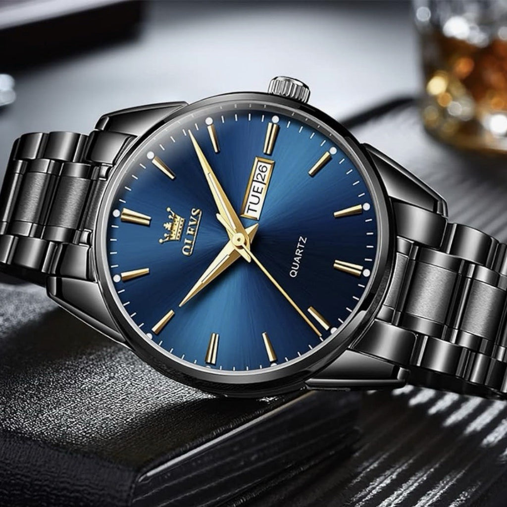NIB OLEVS Men's Luxury Watch 6898G Ion Stainless Steel Band Blue Dial Day/Date