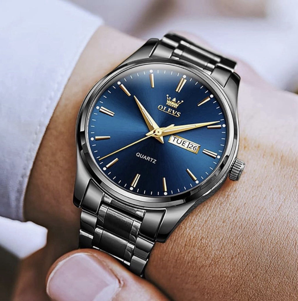 NIB OLEVS Men's Luxury Watch 6898G Ion Stainless Steel Band Blue Dial Day/Date