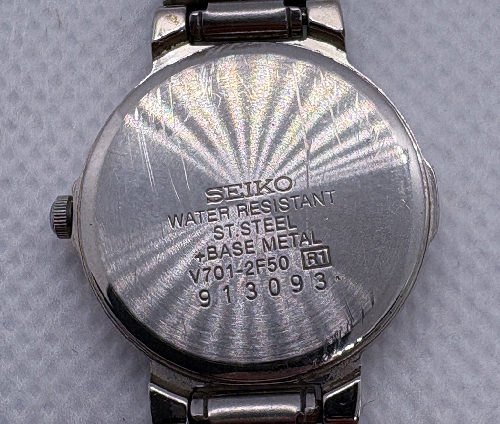 Vintage Seiko V701-2F50 Stainless Steel Silver Patterned Dial Date Quartz Watch