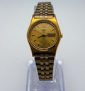 Vintage 1994 Seiko SQ Ladies Watch Gold Tone Day Date 25mm Roman 12 7N83-0081